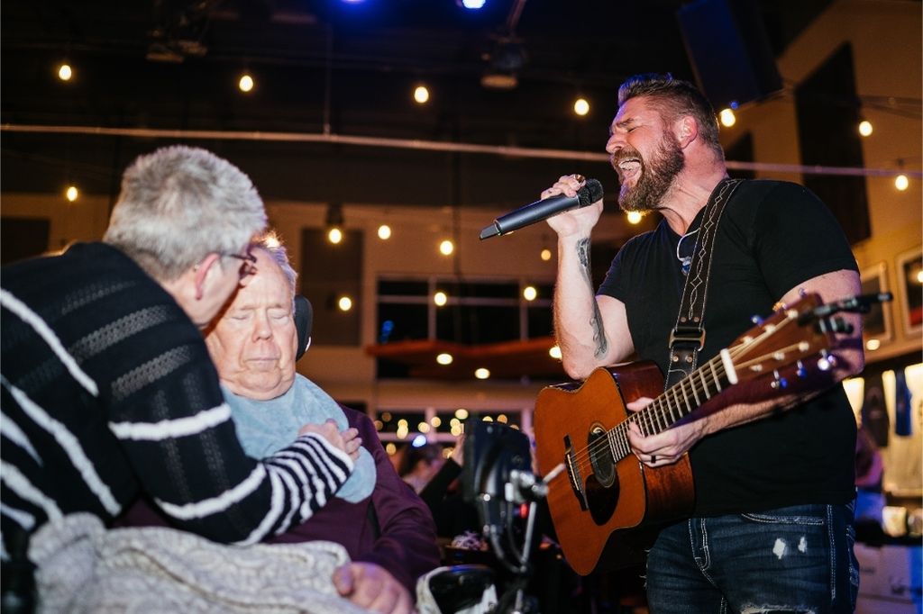 Jimmy Charles with ALS patient and caregiver at a Let Hope Grow event, promoting the Voices of Hope ALS Benefit Concert in East Berlin, PA.