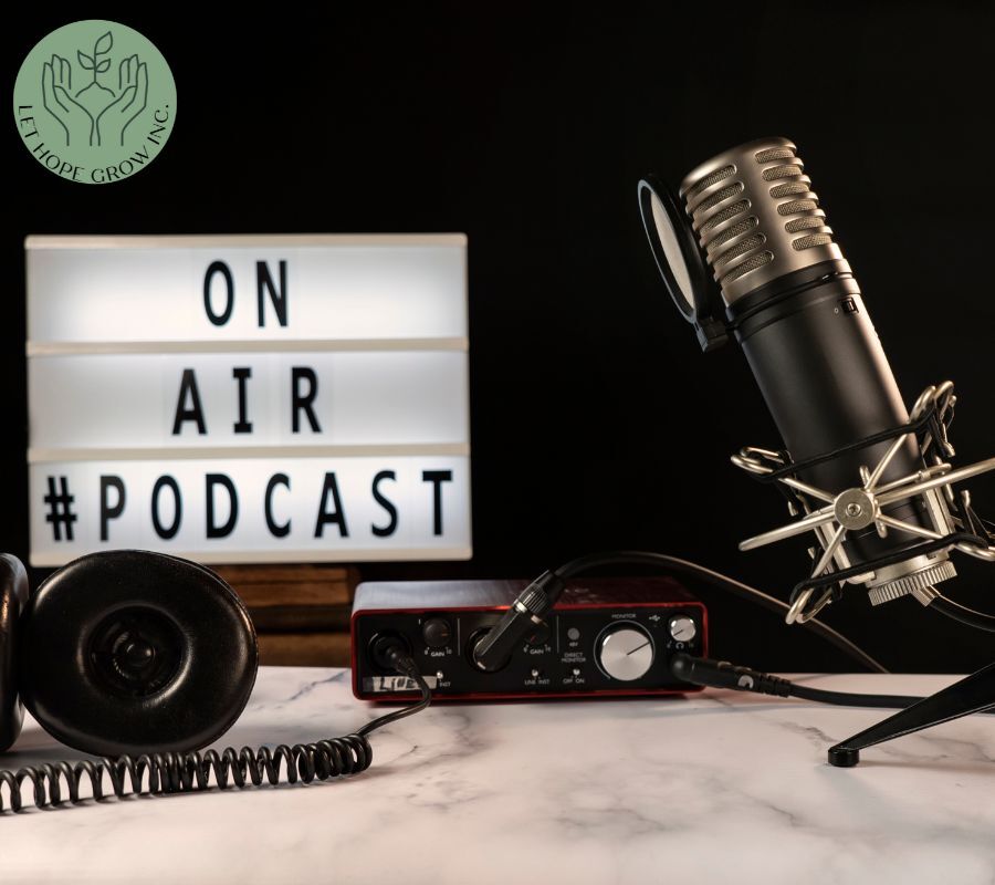 Professional podcast microphone setup with headphones and lightbox sign reading "On Air #Podcast," promoting Lura Sawyer’s iHeartRadio interview on ALS caregiving